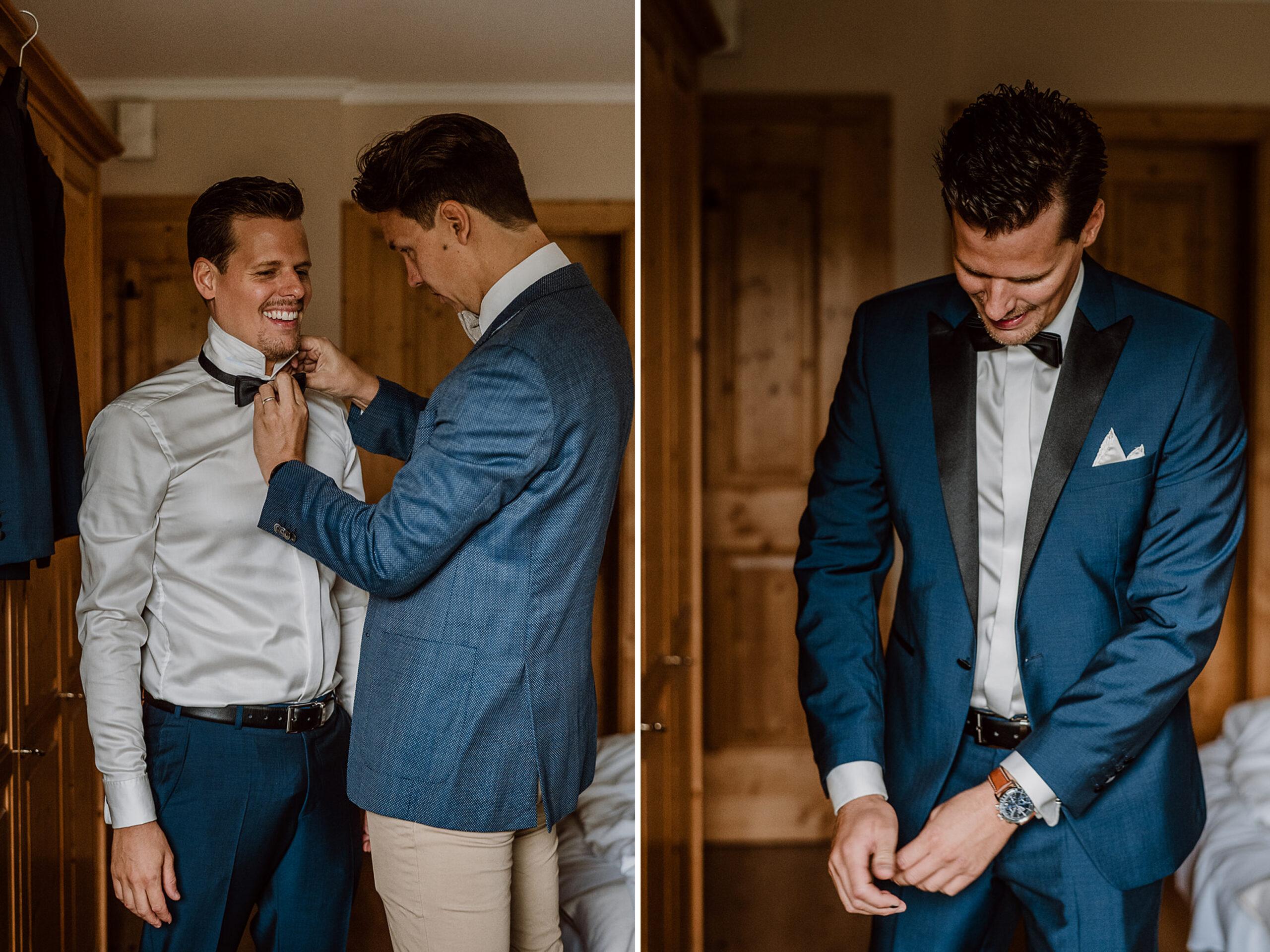 Trauzeuge hilft Bräutigam beim Anziehen des Anzugs